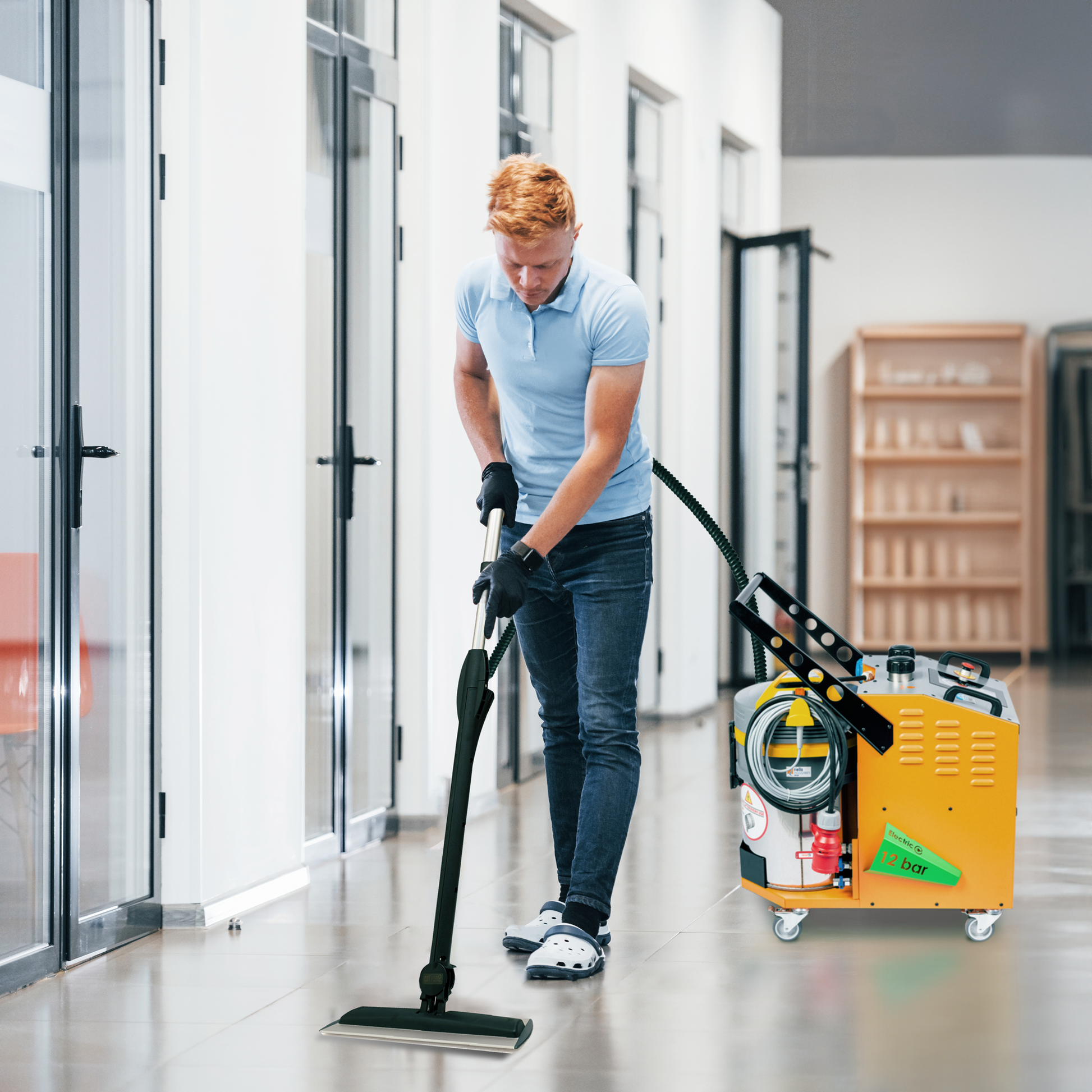 Technician using FORTADOR VOLT ELECTRA steam cleaner for upholstery and interior car detailing